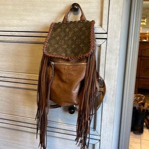 This is a revamp with Louie Vuitton backpack purse